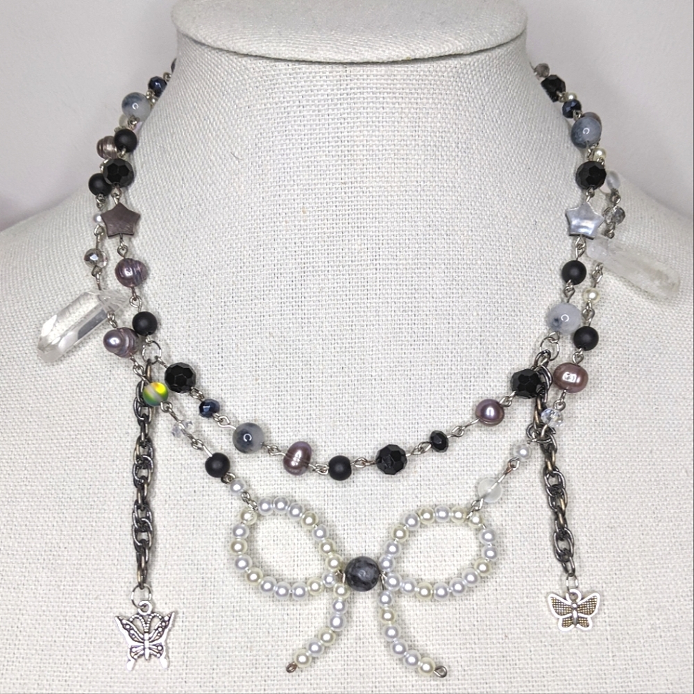 Necklace pearl and glass beads chain charms and a wire bow. Handmade by me.